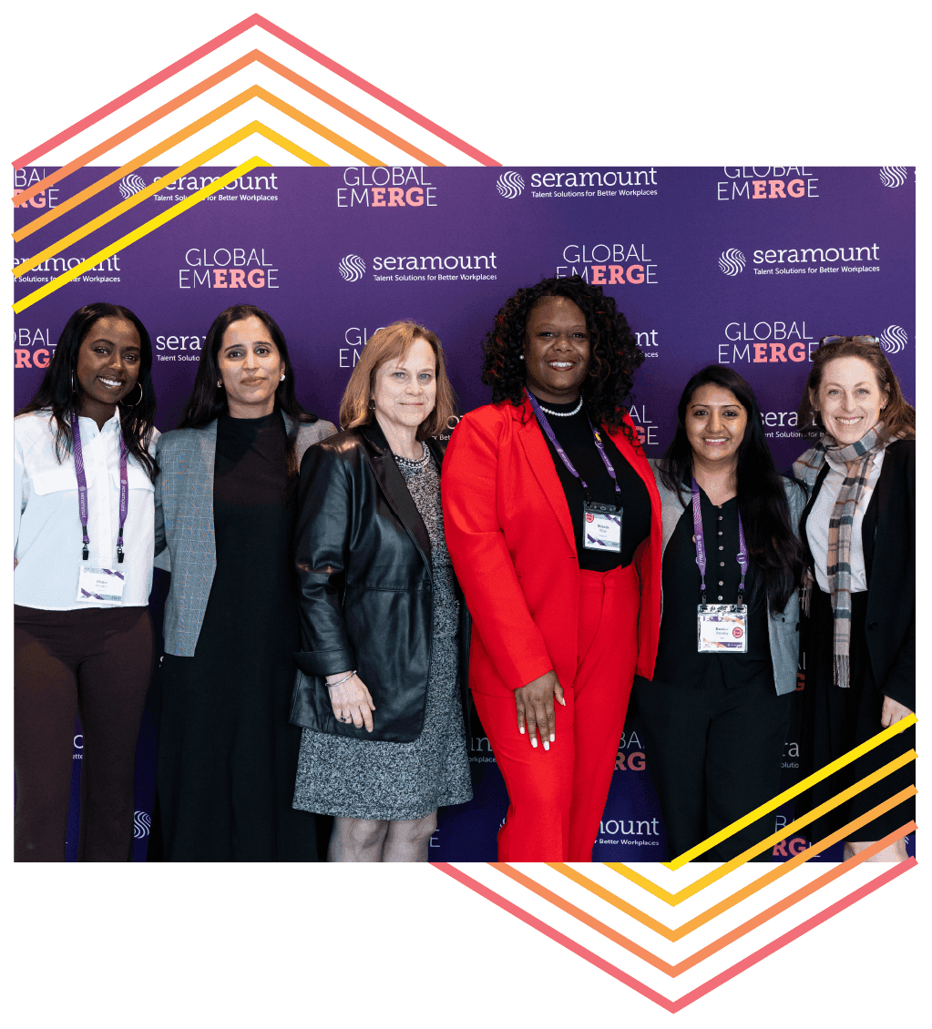 6 women in business attire in front of a purple backdrop with Global EmERGe and Seramount logos