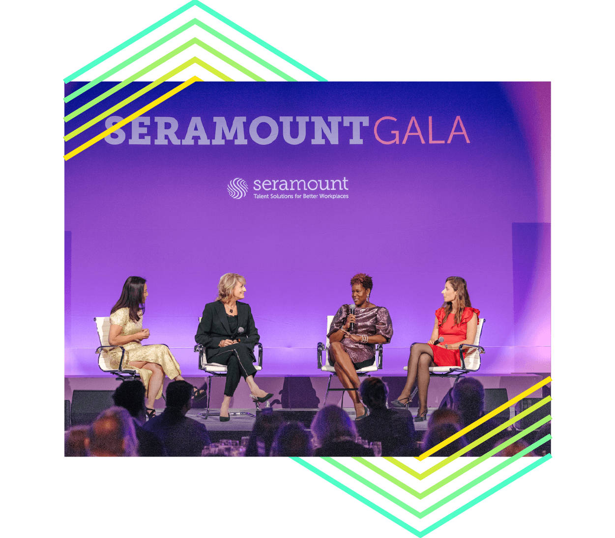 4 people on stage for a panel discussion